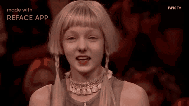 a girl with blonde hair is on a tv screen that says reface app on it