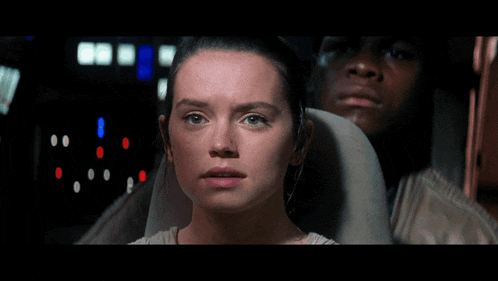 a woman is sitting next to a man with the words banners in the whole galaxy below her