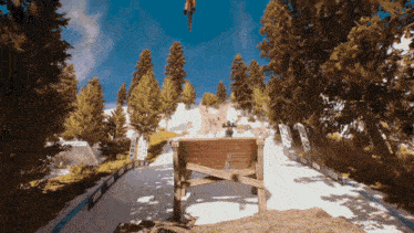 a person on a bike is jumping over a wooden fence with a sign that says ' fox '