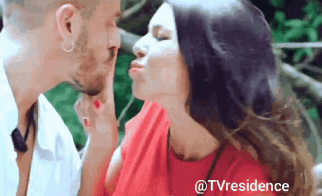 a man and a woman are kissing with the words @tvresidence below them