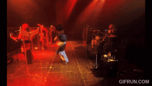 a gif from gifrun.com shows a crowd of people dancing