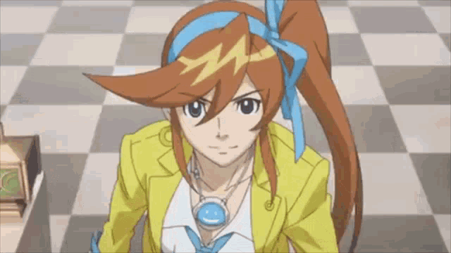 the girl is wearing a yellow jacket and a blue headband and necklace .