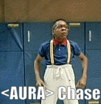 a man in a blue shirt and suspenders is standing in front of a blue wall with the words aura > chase written on it