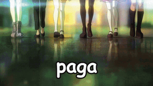 a group of people standing next to the word paga