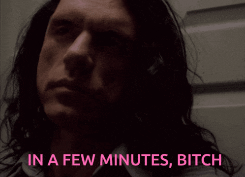 a close up of a man with the words in a few minutes bitch
