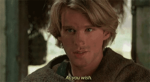 a close up of a man 's face with the words `` as you wish '' written above him .