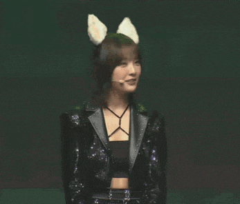 a woman wearing cat ears and a black jacket
