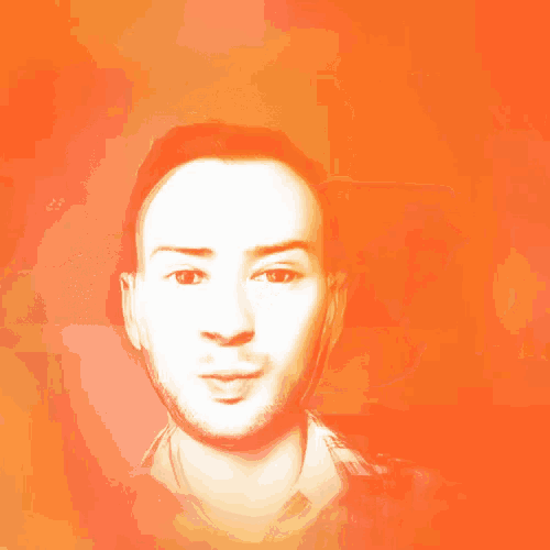 a man 's face is visible through a pair of orange glasses