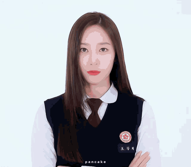 a girl in a school uniform with a name tag that says pancake