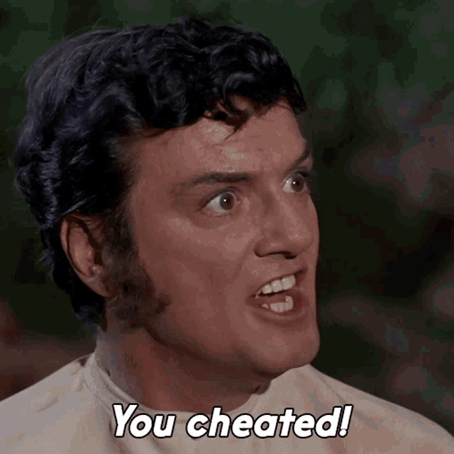 a close up of a man 's face with the caption you cheated