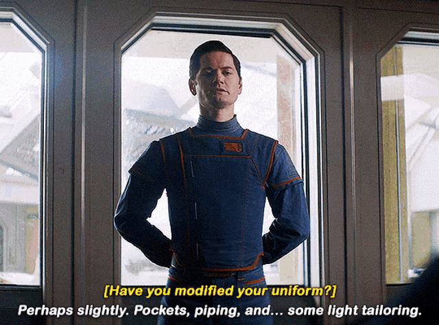 a man in a blue uniform is standing in front of a window and says " have you modified your uniform "