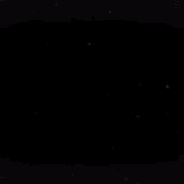 snow is falling on a black background in slow motion