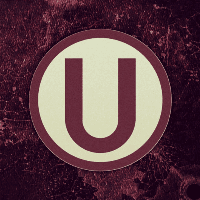 the letter u is in a white circle on a dark background