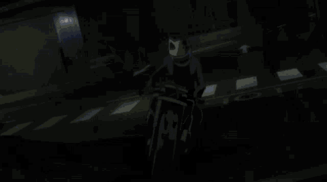 a dark room with a light coming out of the door