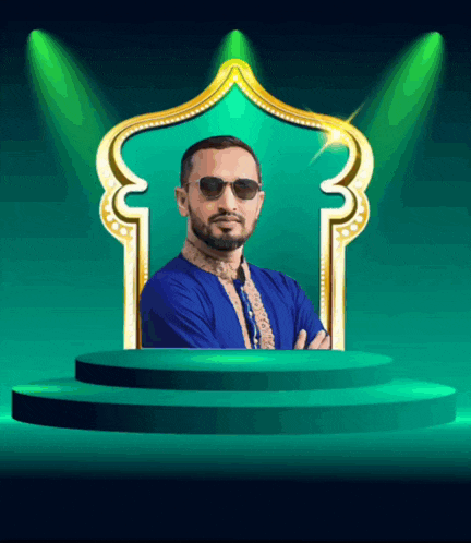 a man wearing sunglasses and a blue shirt stands on a green stage