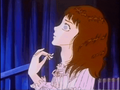 a cartoon girl with red hair is sitting in a crib and looking up .