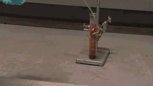 a light bulb is sitting on a table and glowing brightly