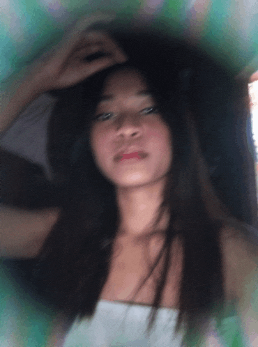 a blurry picture of a woman 's face and hair