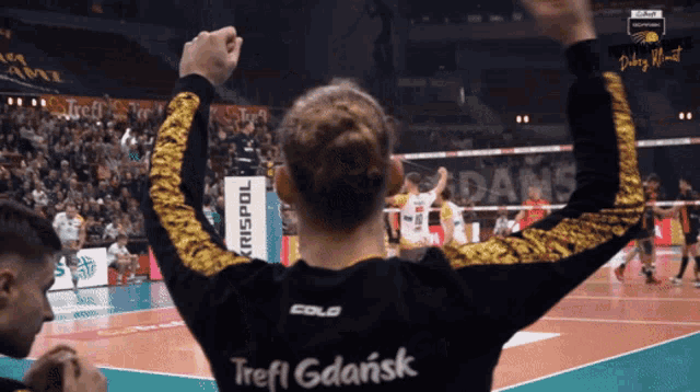 a person wearing a shirt that says trefl gdansk on it