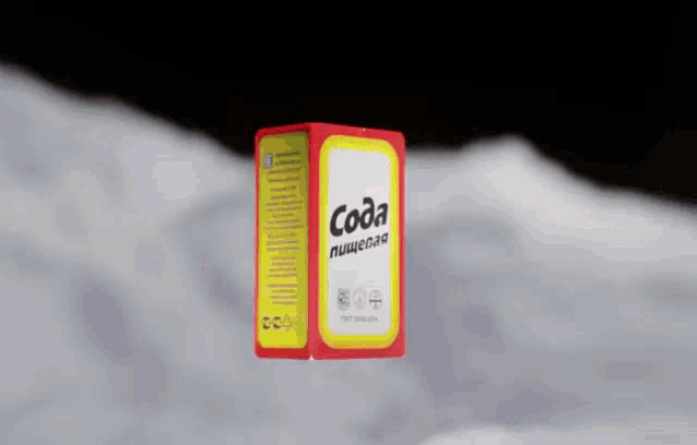 a box of coda is floating in the air .