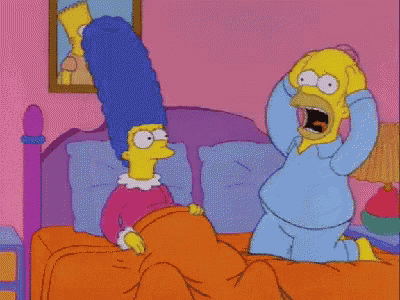 a cartoon of homer simpson yelling at marge simpson in bed