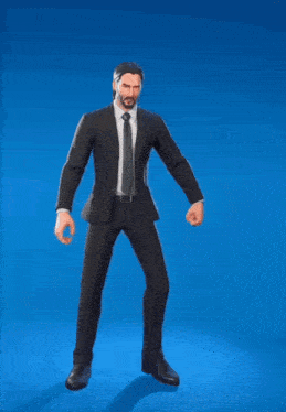 a man in a suit and tie is holding a large sword