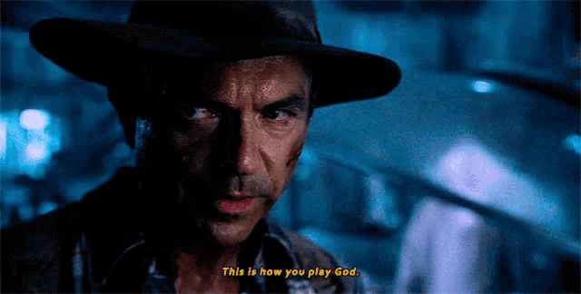 a man wearing a hat says this is how you play god