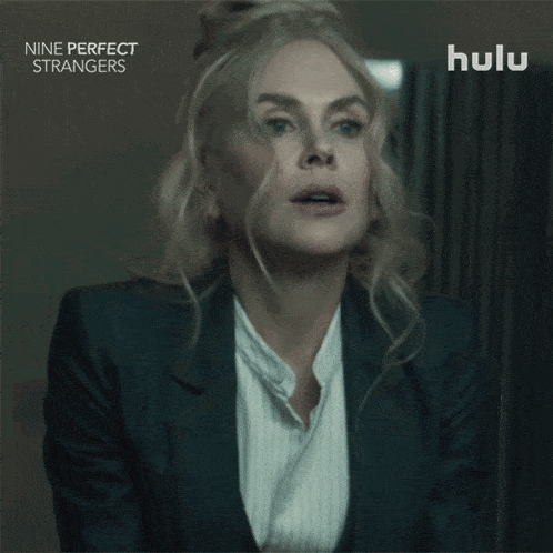 a woman with a surprised look on her face is on a hulu ad