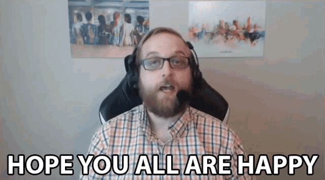 a man in a plaid shirt and headphones says hope you all are happy