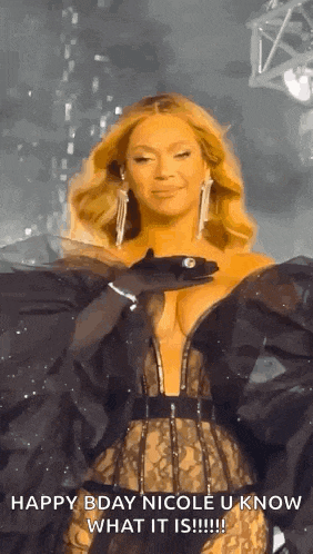a woman in a very revealing dress is standing on a stage holding a glove .