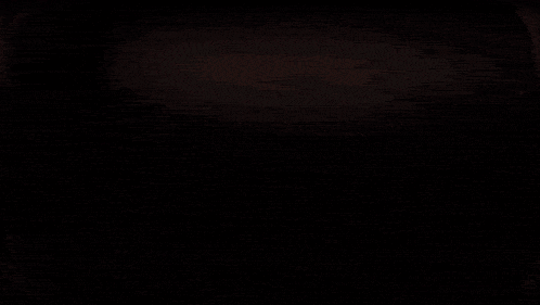 a close up of a glowing electrical wave in a dark room