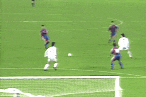 a soccer goal with a few pieces of trash on the ground