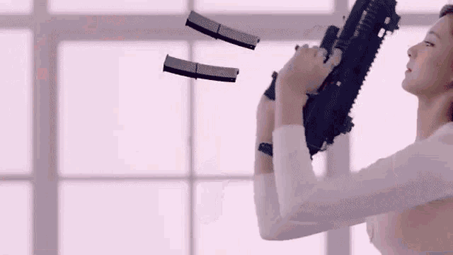 a group of women are holding guns in their hands .