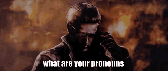 a man is standing in front of a fire with the words what are your pronouns written above him .
