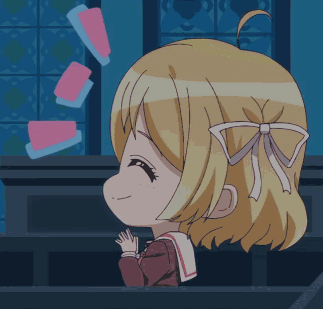 a girl with a bow in her hair is smiling with cards flying in the air