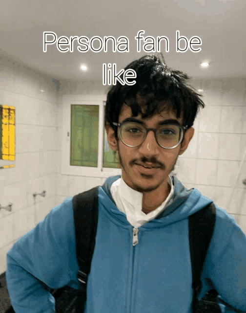 a man wearing glasses and a blue jacket with the words persona fan be like written on it