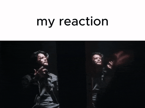 a man singing into a microphone with the words " my reaction " behind him