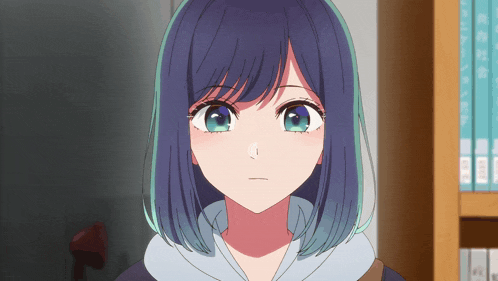 a close up of a girl 's face with blue hair and green eyes