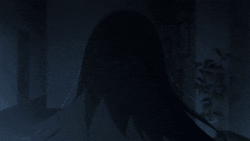 a girl with long black hair is looking up at something in the dark