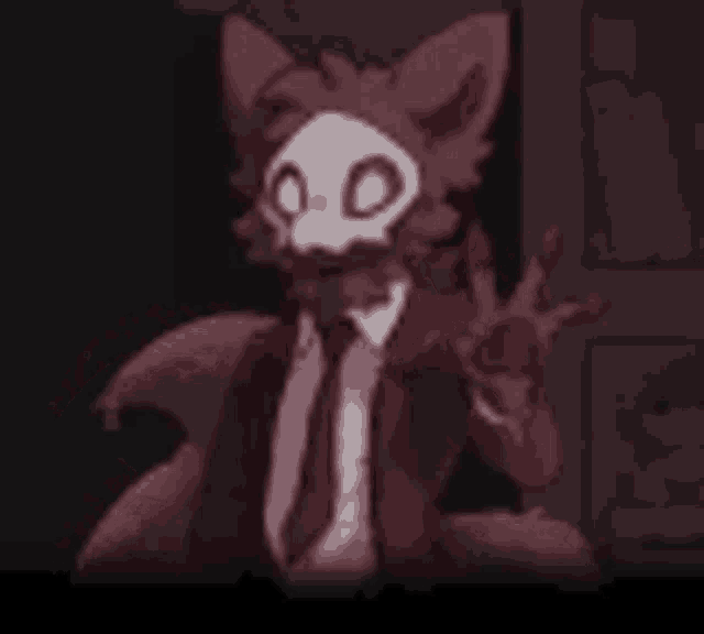 a furry character wearing a suit and tie is giving a peace sign in a dark room .