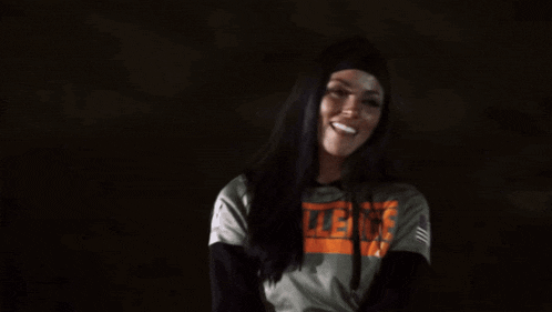 a woman wearing a hoodie with the word violence on it .