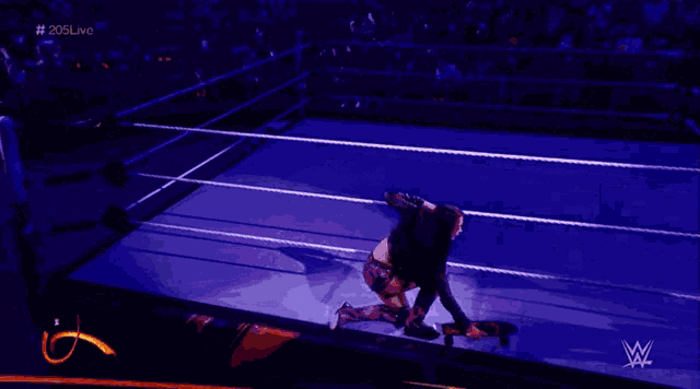a woman in a wrestling ring with the name cora jade on the screen