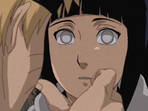 a close up of a person touching another person 's face with their hand