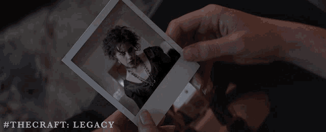 a person is holding a polaroid picture of a woman with the hashtag #thecraft legacy