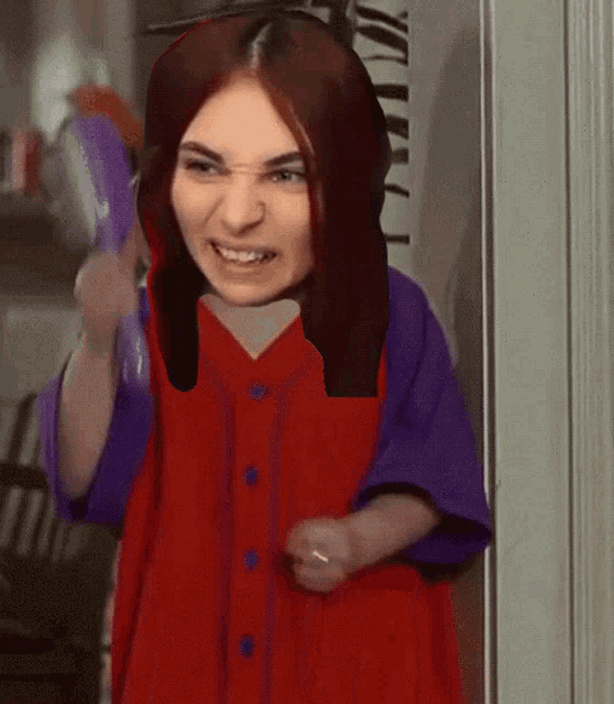 a woman in a red shirt and purple shirt is holding a purple bag