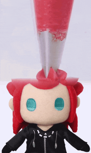 a stuffed toy with red hair and blue eyes has a zipper on the jacket