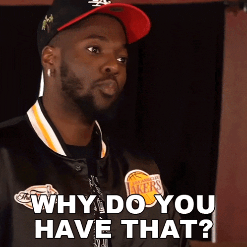 a man wearing a lakers jacket and hat says why do you have that