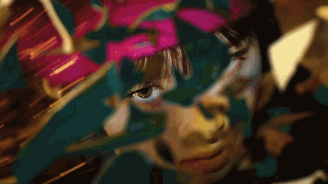 a blurry picture of a woman 's face with a pink fringe