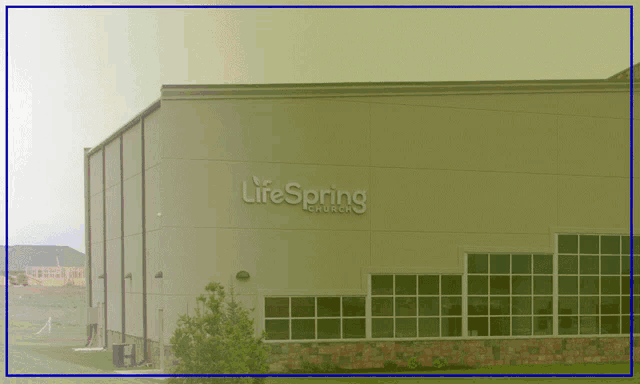 a large building with the word lifespring on it
