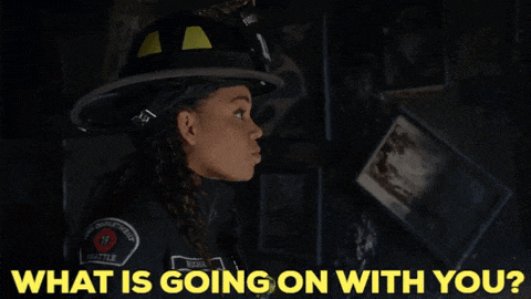 a woman in a firefighter uniform is asking what is going on with her